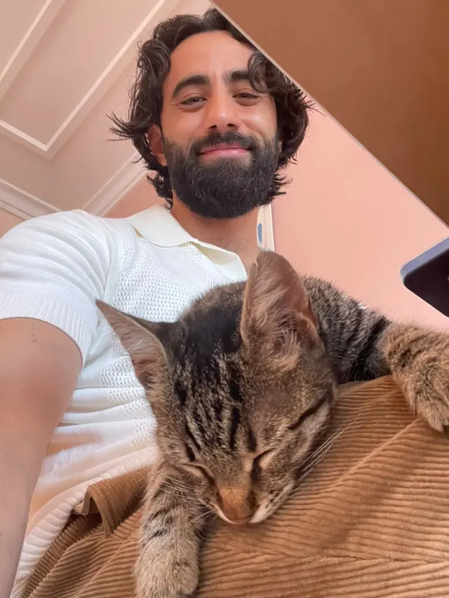 Dr. Ahmad Deeb at home with his cat