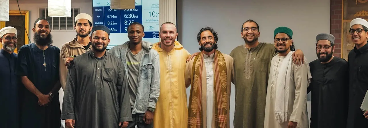 Dr. Ahmad Deeb with a group of community members at a masjid